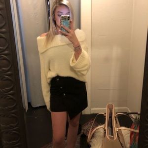 black skirt with a pop of white buttons.